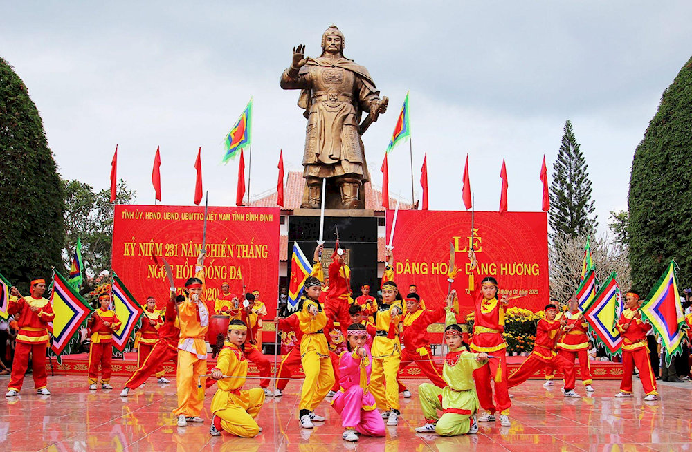 The anniversary of the Ngoc Hoi-Dong Da victory is commemorated with spirited dances and flags